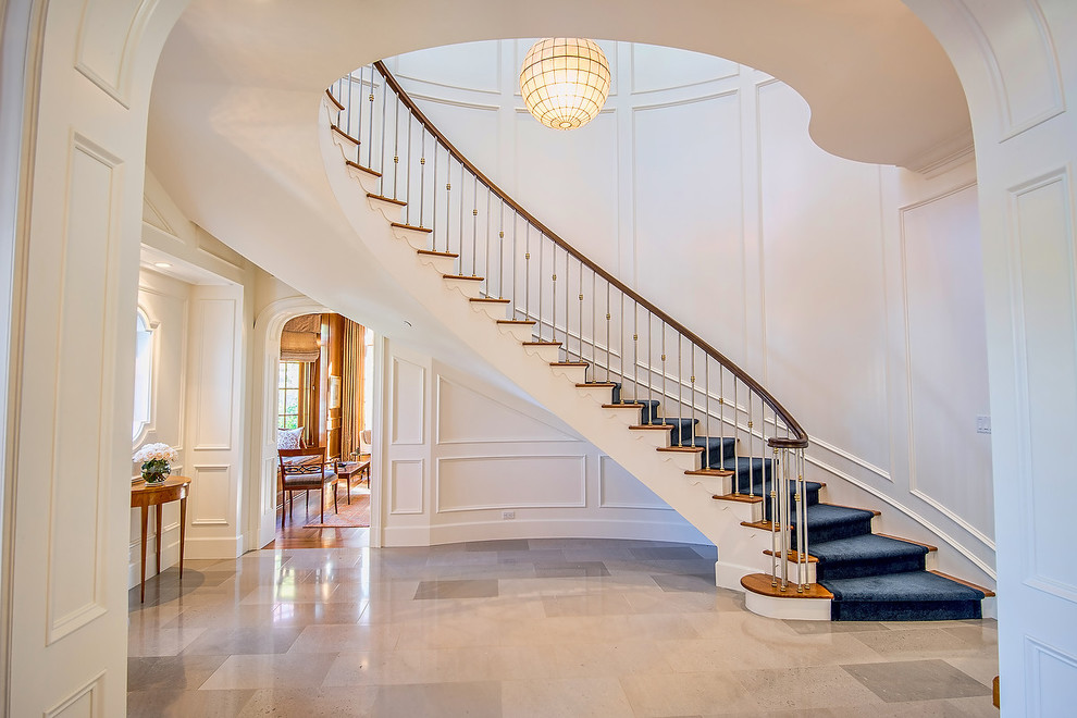 Design ideas for a traditional wood curved staircase in Los Angeles.