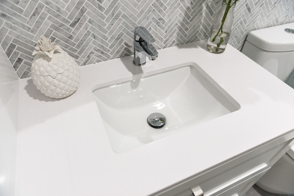 Inspiration for a small traditional master bathroom in Perth with shaker cabinets, white cabinets, an open shower, a one-piece toilet, multi-coloured tile, mosaic tile, multi-coloured walls, porcelain floors, an undermount sink, solid surface benchtops, grey floor, an open shower and white benchtops.