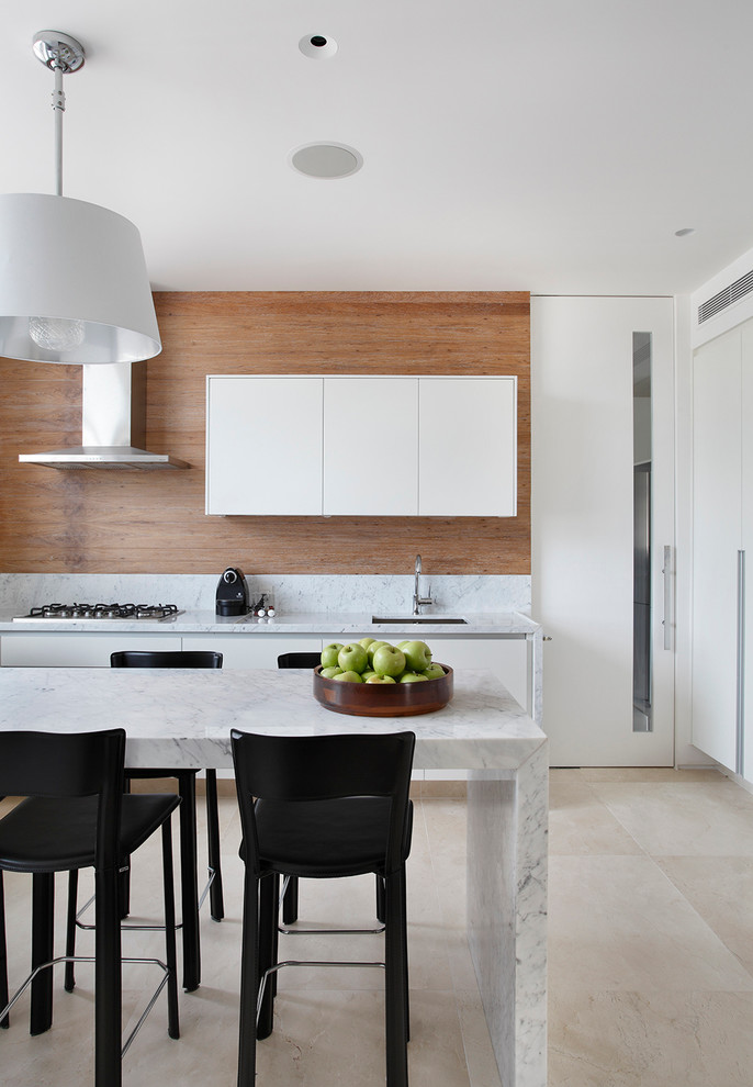 Photo of a modern eat-in kitchen in Other with an undermount sink, flat-panel cabinets, white cabinets and marble benchtops.