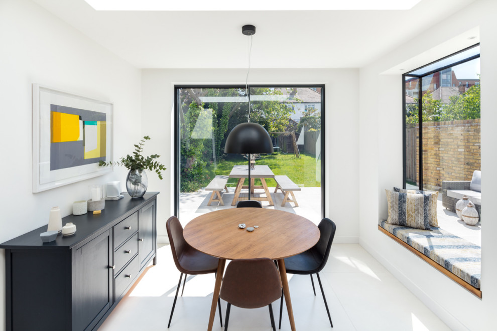 This is an example of a medium sized contemporary dining room in London.
