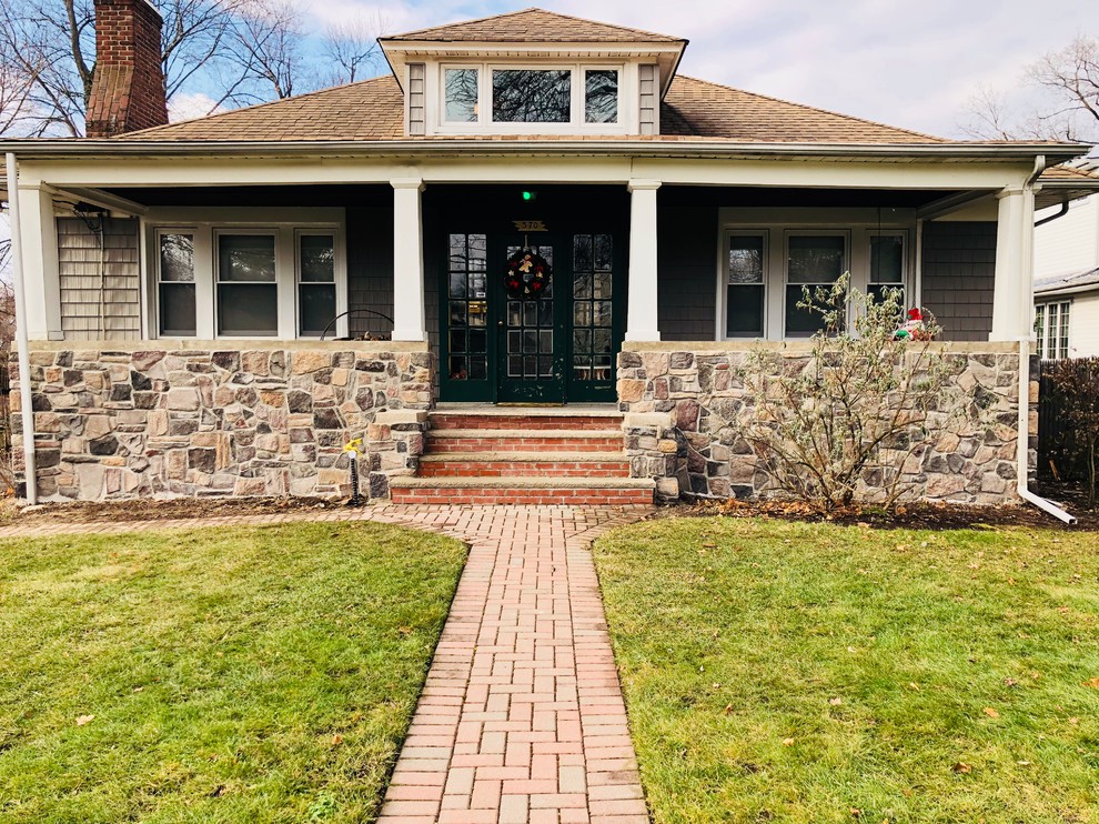 Elegant gray one-story mixed siding house exterior photo in New York with a hip roof and a shingle roof