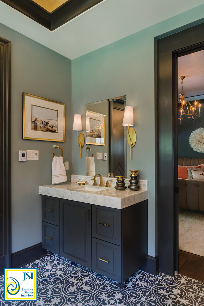 Design ideas for a mid-sized transitional master bathroom in Richmond with furniture-like cabinets, grey cabinets, a freestanding tub, a corner shower, a one-piece toilet, black and white tile, porcelain tile, blue walls, porcelain floors, an undermount sink and marble benchtops.