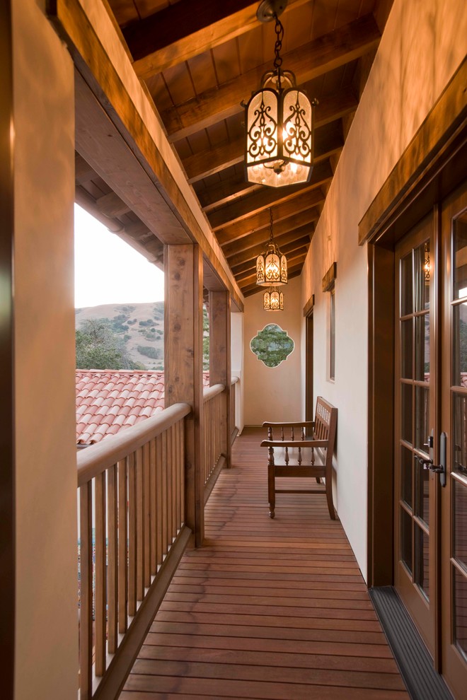 Balcony - mid-sized mediterranean balcony balcony idea in San Francisco with a roof extension