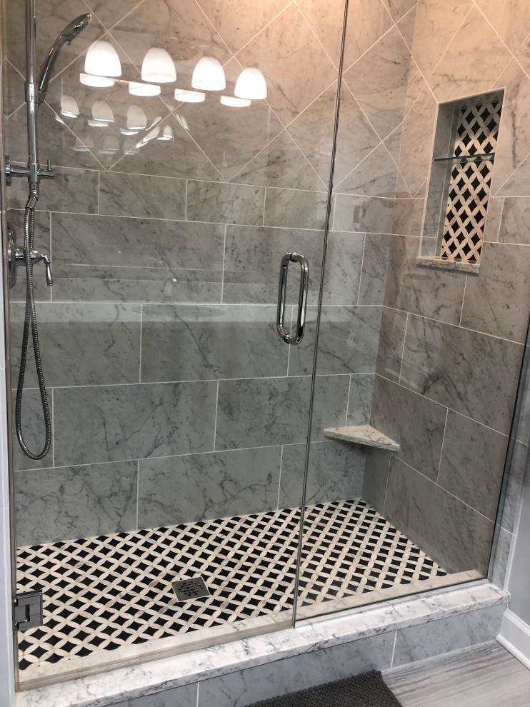 Inspiration for a mid-sized modern 3/4 bathroom in Chicago with shaker cabinets, grey cabinets, an alcove shower, grey walls, vinyl floors, an undermount sink, engineered quartz benchtops, brown floor, a sliding shower screen and white benchtops.