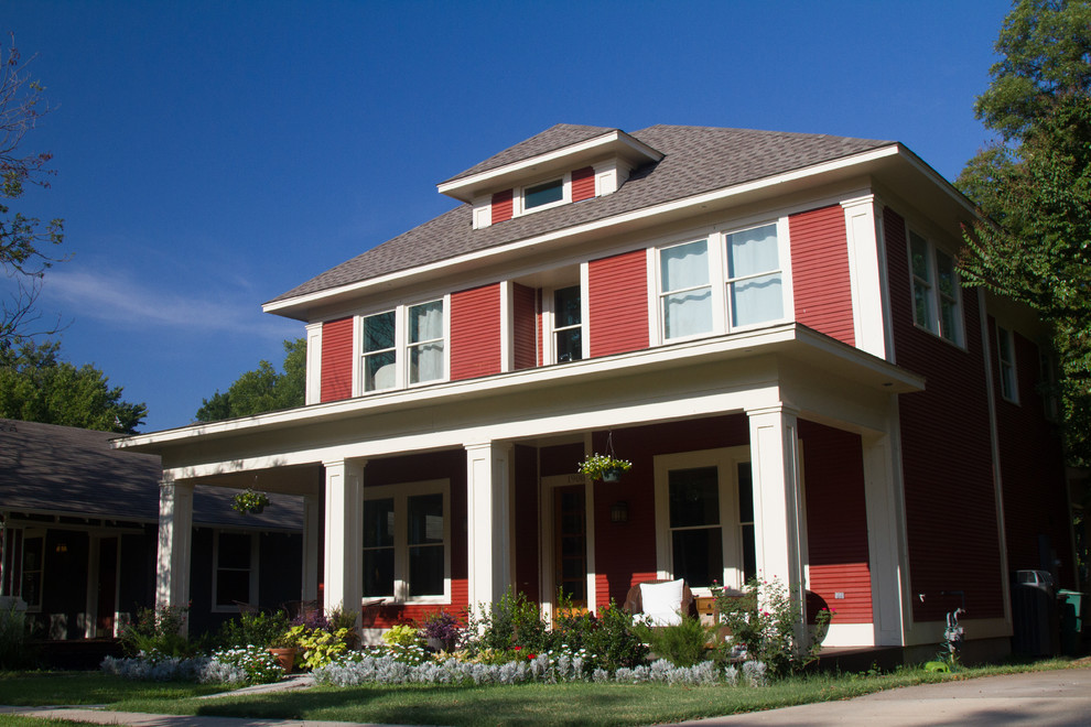 Design ideas for a large arts and crafts two-storey red exterior in Dallas with wood siding.
