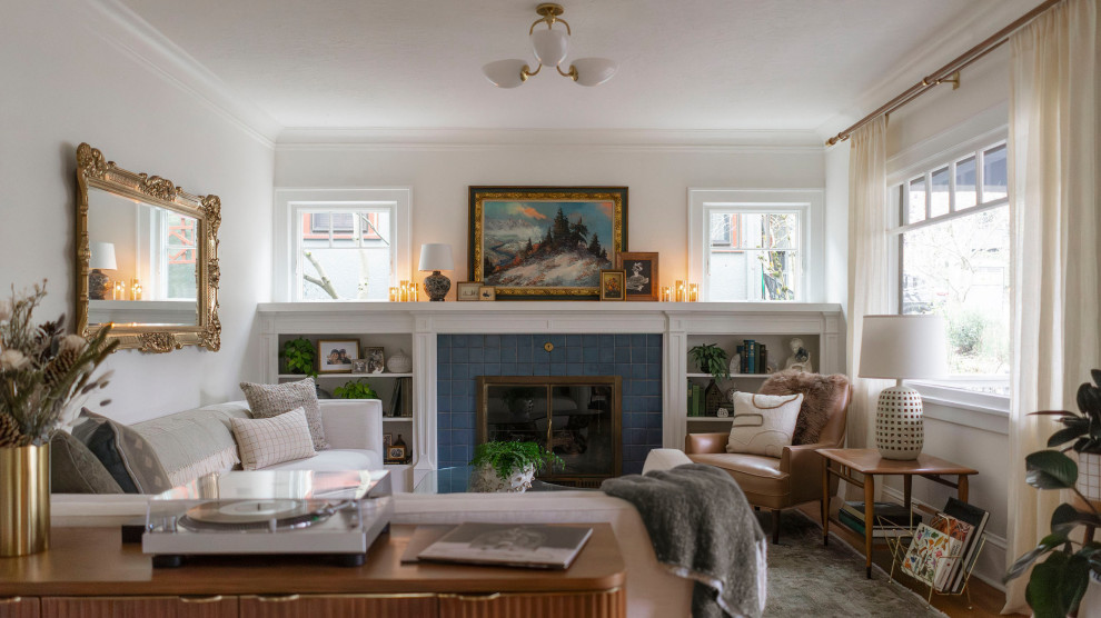 Example of a mid-sized transitional formal and enclosed medium tone wood floor and brown floor living room design in Portland with white walls, a standard fireplace, a tile fireplace and no tv