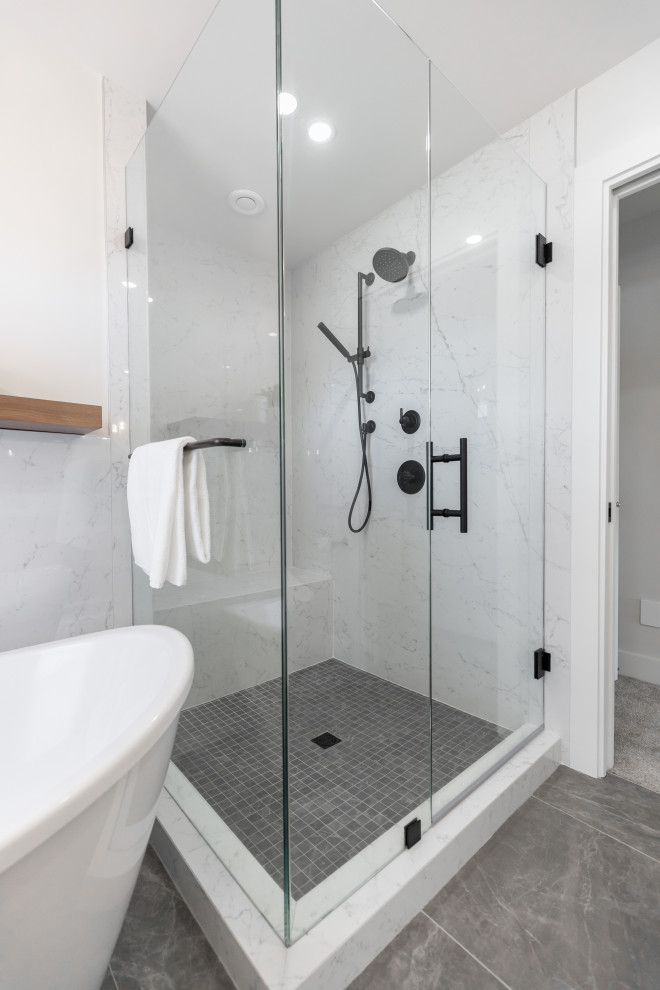 Inspiration for a large contemporary master white tile and porcelain tile porcelain tile, gray floor and double-sink bathroom remodel in Vancouver with flat-panel cabinets, brown cabinets, a drop-in sink, quartzite countertops, a hinged shower door, white countertops and a floating vanity