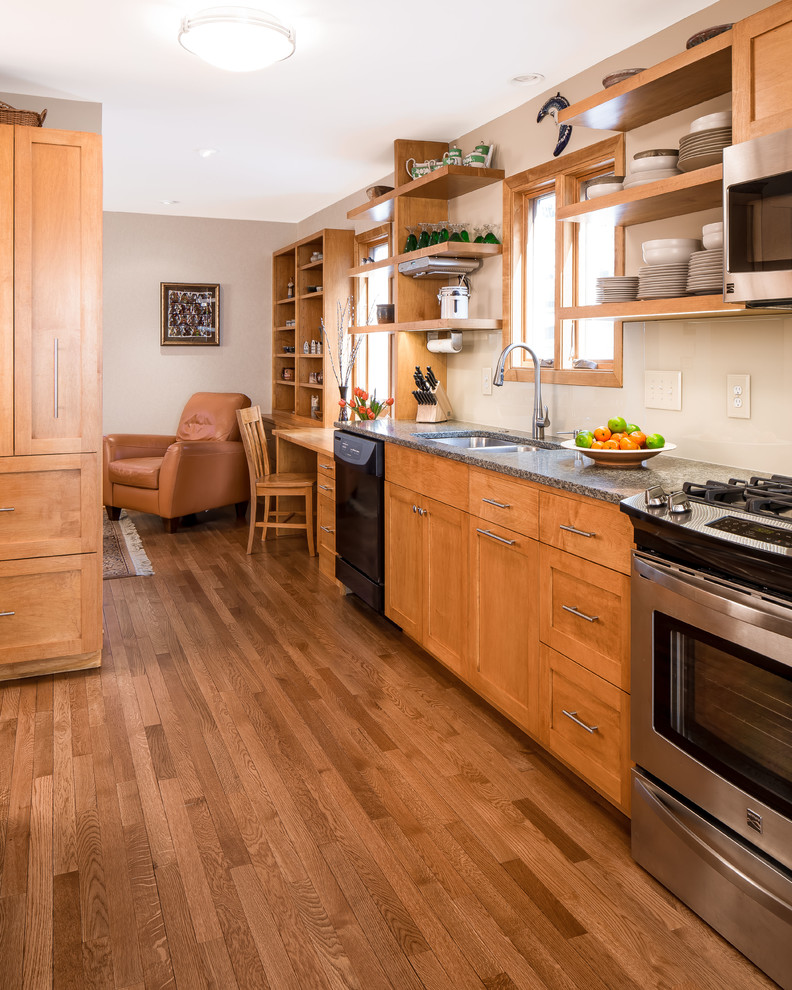 Inspiration for a transitional kitchen in Minneapolis with shaker cabinets, medium wood cabinets, stainless steel appliances and medium hardwood floors.