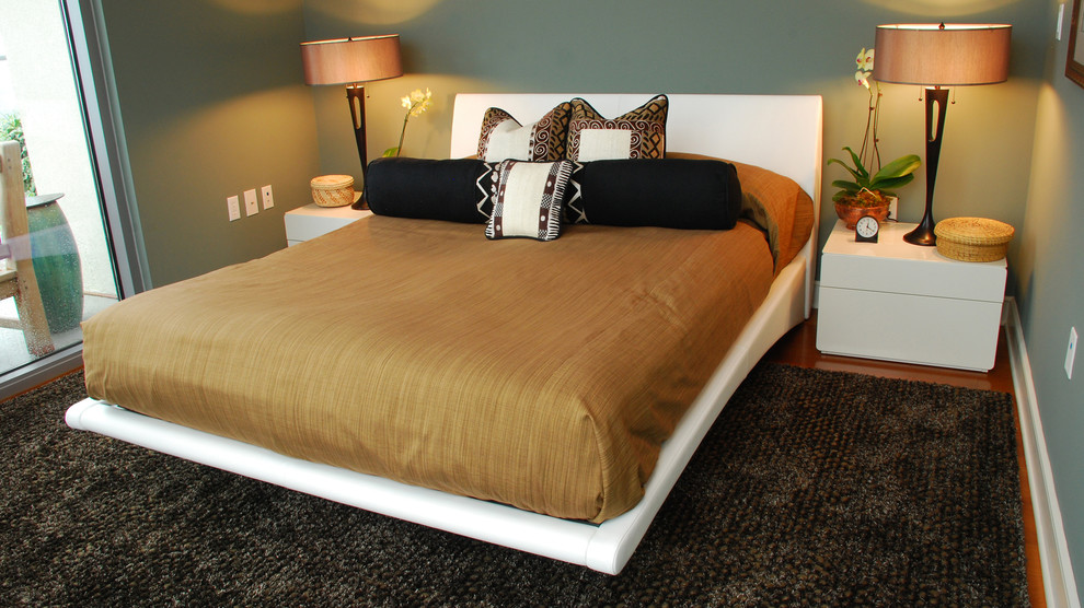 Inspiration for a large contemporary guest medium tone wood floor bedroom remodel in Atlanta