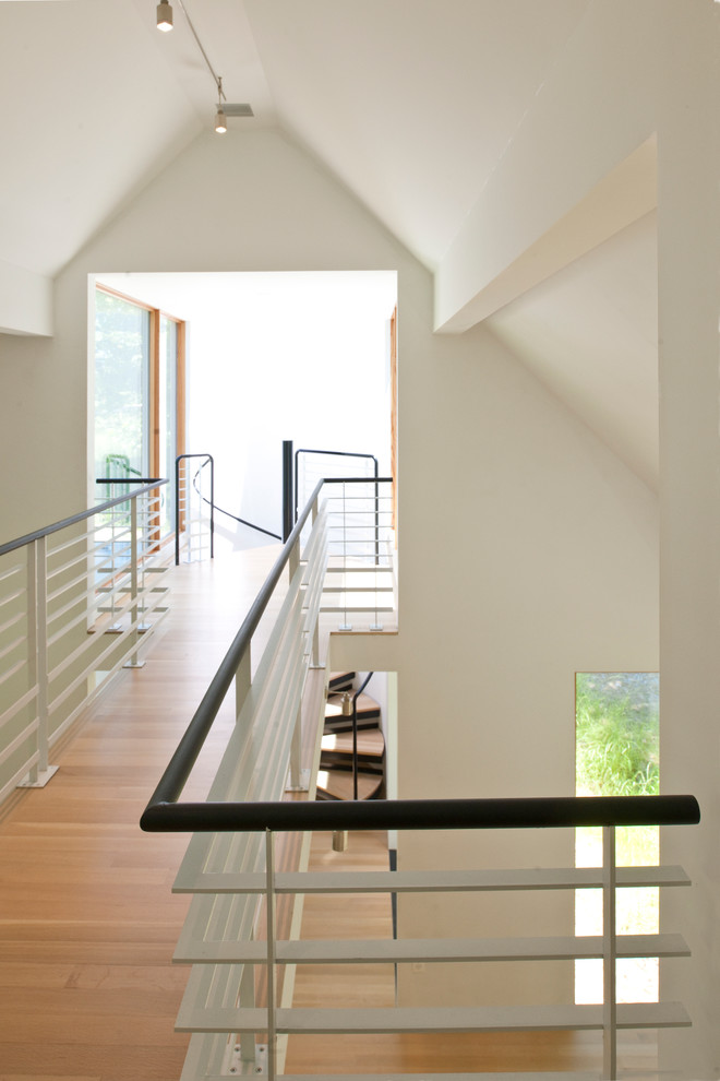 Inspiration for a small modern wood spiral staircase in Baltimore with open risers.