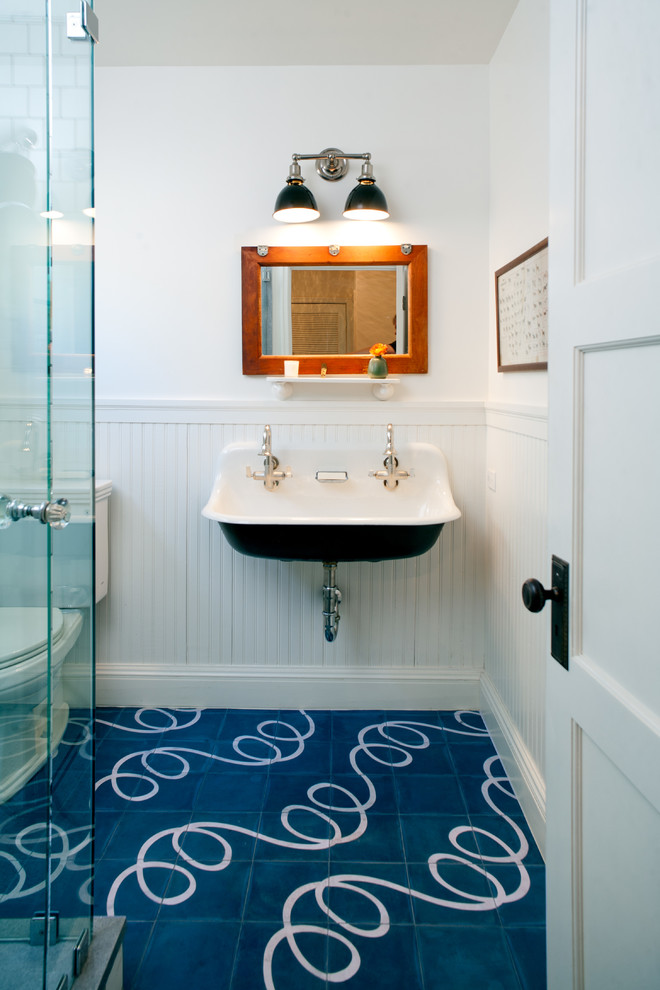 Inspiration for a mid-sized country 3/4 bathroom in Los Angeles with a trough sink, a two-piece toilet, white walls, ceramic floors and blue floor.