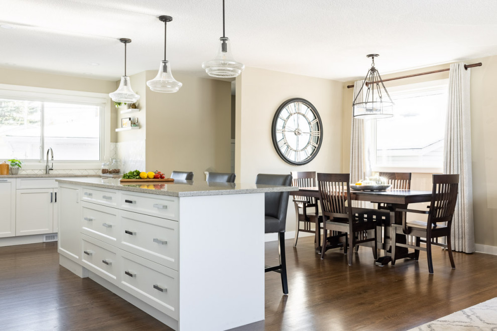 Example of a transitional home design design in Calgary
