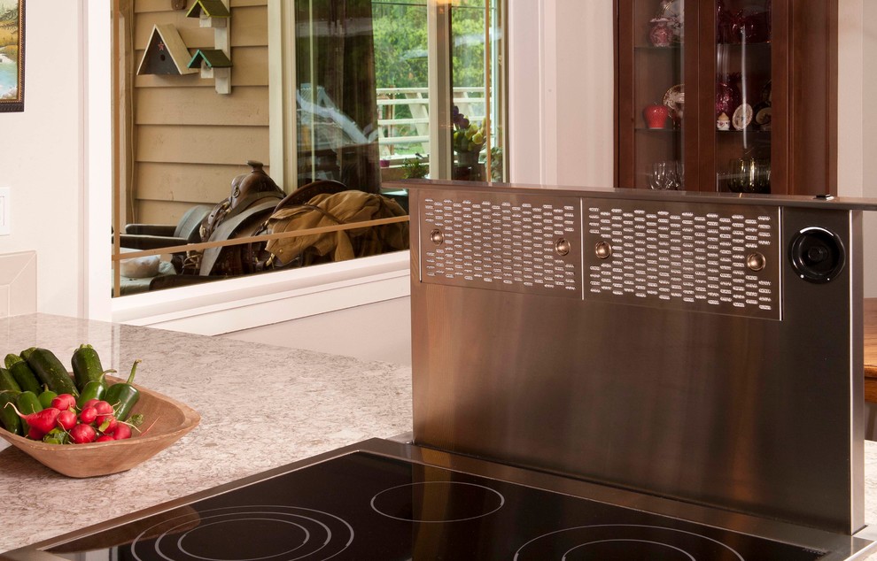 Example of a mid-sized transitional dark wood floor kitchen design in Seattle with an undermount sink, shaker cabinets, dark wood cabinets, beige backsplash, subway tile backsplash, stainless steel appliances and a peninsula