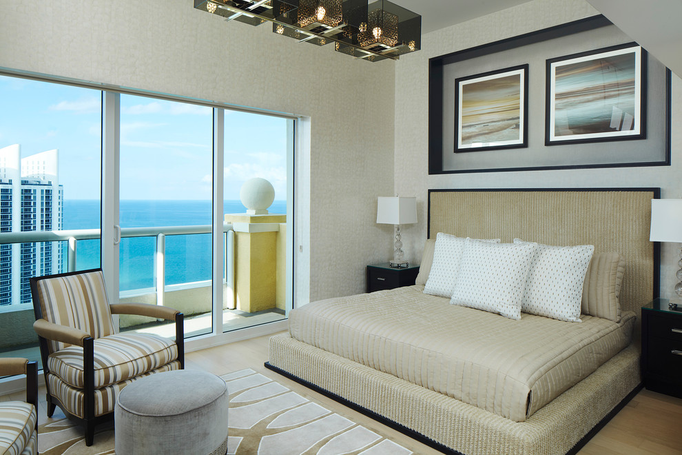 Mid-sized contemporary master bedroom in Miami with beige walls, light hardwood floors, no fireplace and beige floor.