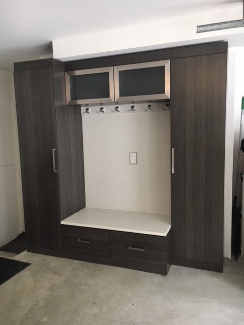 Mudroom - modern concrete floor mudroom idea in Seattle