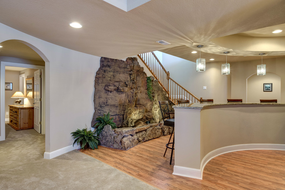 Photo of an expansive traditional look-out basement in Denver with beige walls, vinyl floors, no fireplace and brown floor.