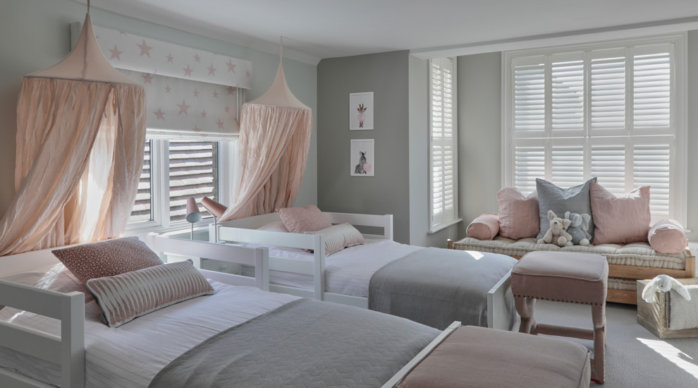 Transitional kids' bedroom in Hertfordshire with grey walls, carpet and beige floor for girls.