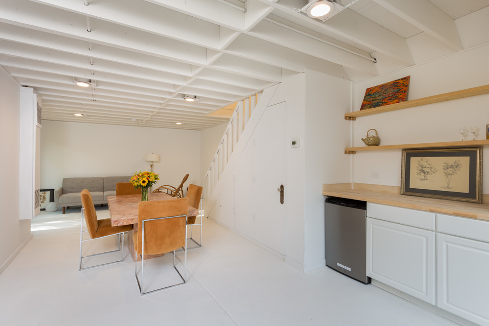 This is an example of a mid-sized scandinavian open plan dining in Chicago with white walls and no fireplace.