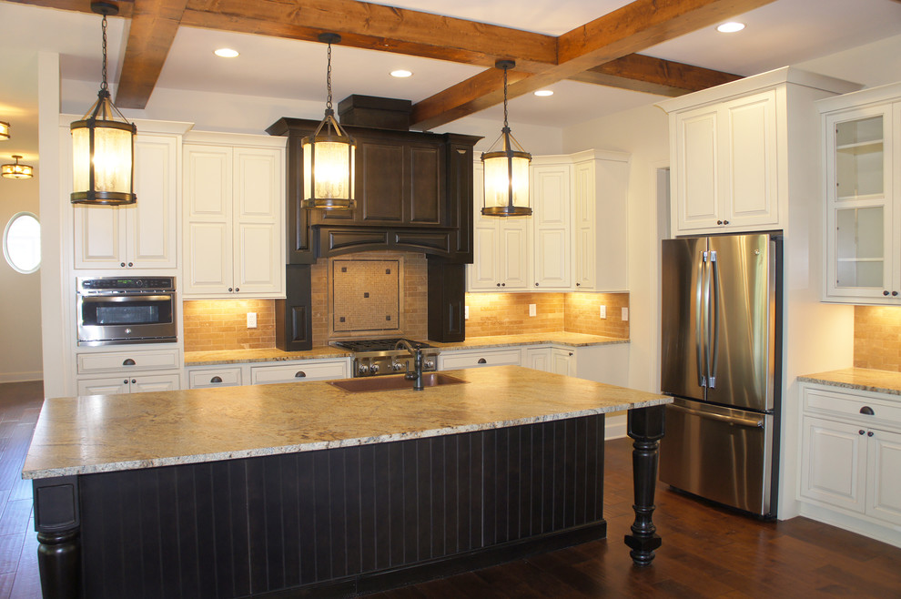 Inspiration for a large rustic l-shaped medium tone wood floor and brown floor eat-in kitchen remodel in Indianapolis with an undermount sink, raised-panel cabinets, white cabinets, granite countertops, brown backsplash, stone tile backsplash, stainless steel appliances, an island and brown countertops