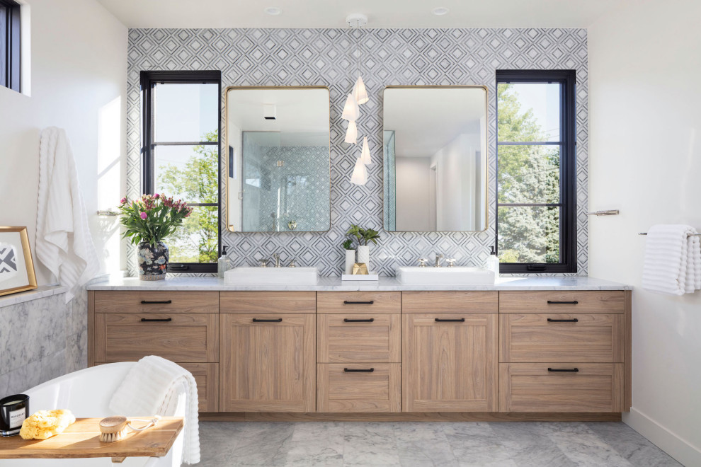 Example of a large transitional master mosaic tile marble floor, white floor and double-sink bathroom design in Denver with shaker cabinets, medium tone wood cabinets, a one-piece toilet, white walls, a vessel sink, marble countertops, a hinged shower door, white countertops and a built-in vanity