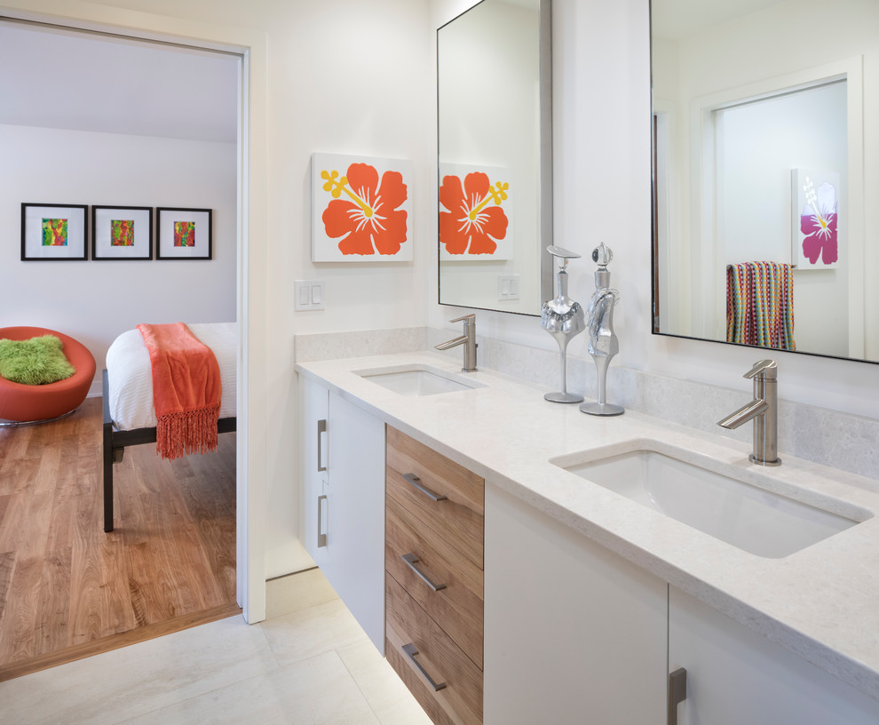Design ideas for an expansive contemporary kids bathroom in Minneapolis with flat-panel cabinets, medium wood cabinets, a shower/bathtub combo, a bidet, white tile, porcelain tile, white walls, porcelain floors, an undermount sink, engineered quartz benchtops and a shower curtain.