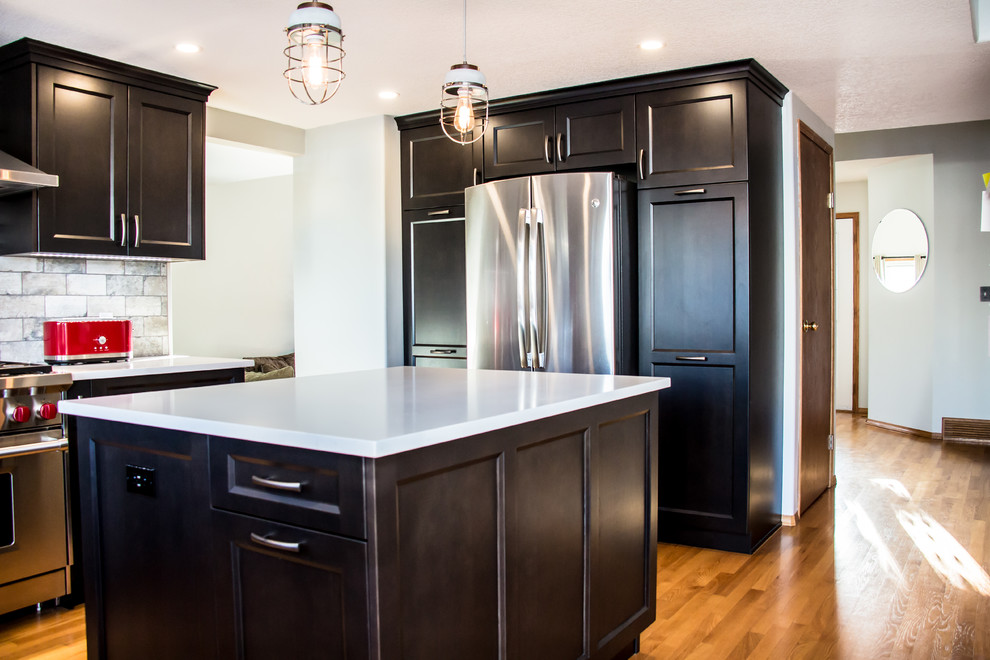 Example of a transitional kitchen design in Calgary