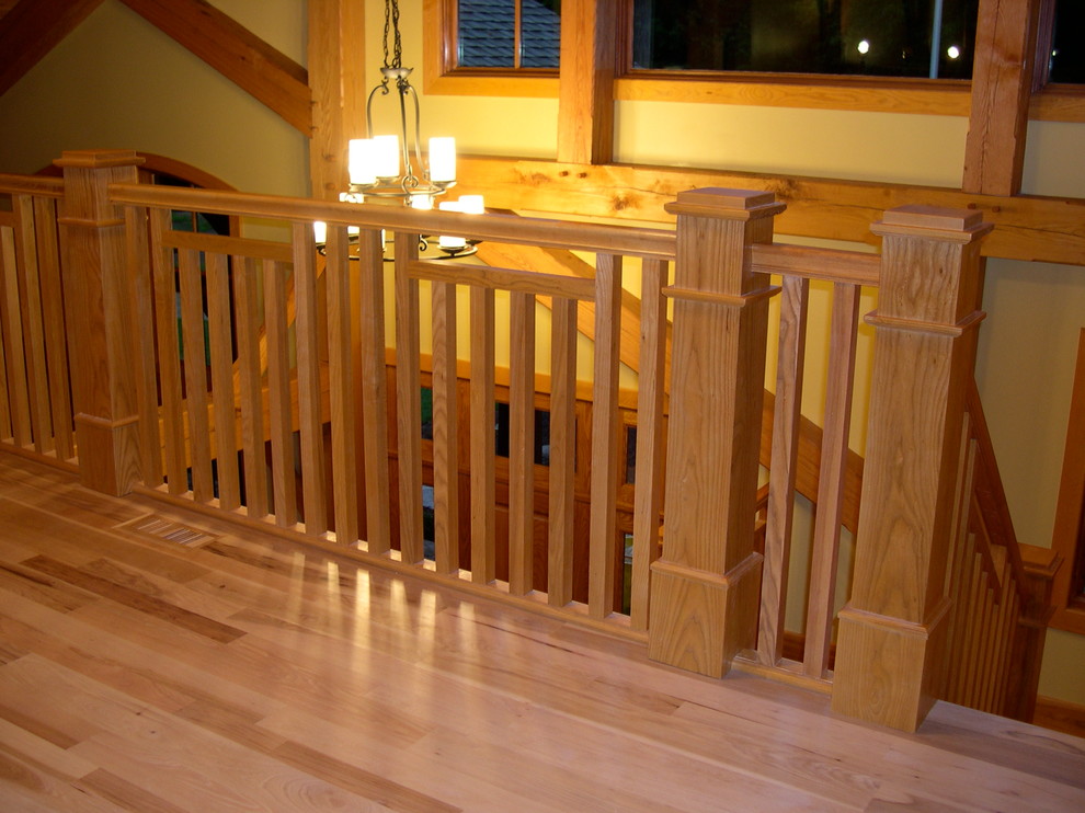 Mid-sized mountain style wooden u-shaped staircase photo in Chicago with wooden risers