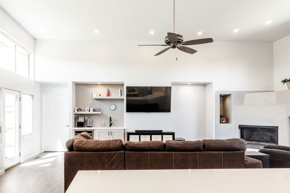 Large transitional u-shaped vinyl floor and gray floor eat-in kitchen photo with an undermount sink, shaker cabinets, gray cabinets, quartzite countertops, green backsplash, subway tile backsplash, stainless steel appliances, an island and white countertops