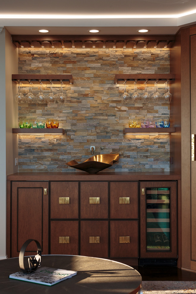 Design ideas for a transitional single-wall wet bar in Chicago with medium wood cabinets, wood benchtops, multi-coloured splashback, stone tile splashback and brown benchtop.