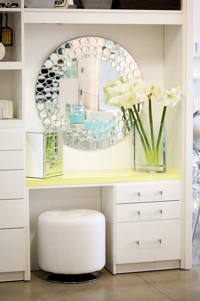 Inspiration for a contemporary dressing room in Other with white cabinets.