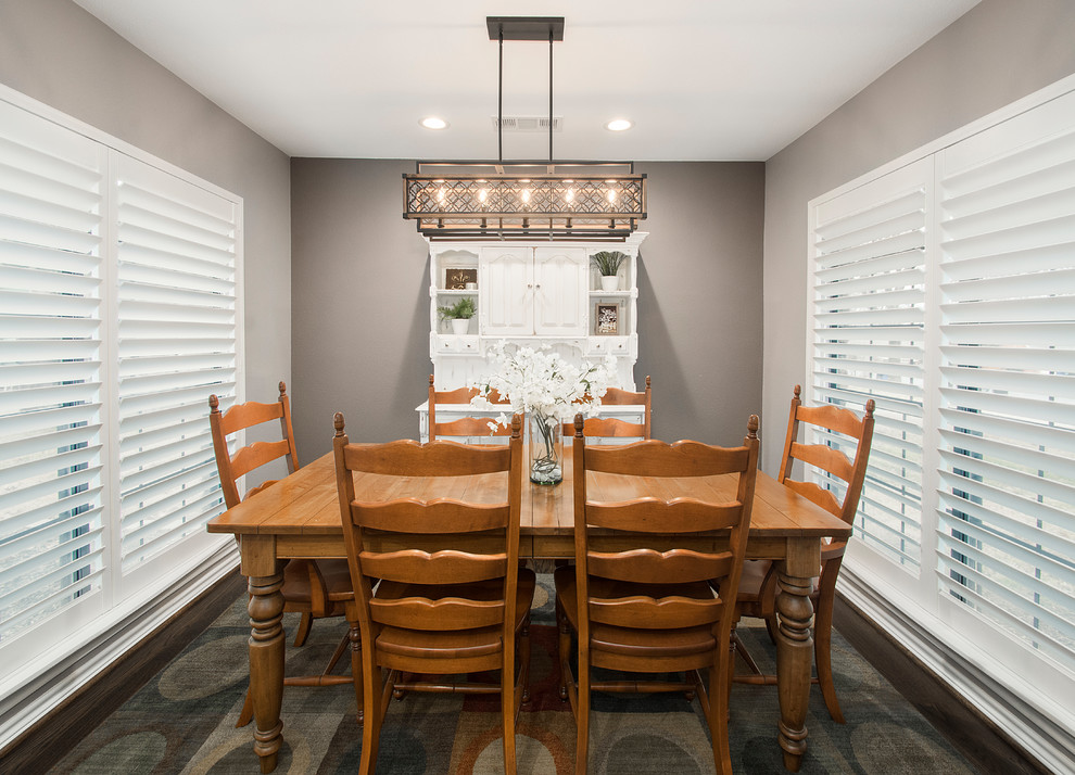 Mid-sized transitional open plan dining in Dallas with medium hardwood floors and brown floor.