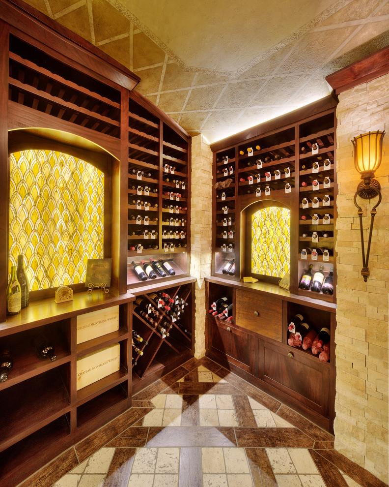 This is an example of a large mediterranean wine cellar in Kansas City with ceramic floors and storage racks.