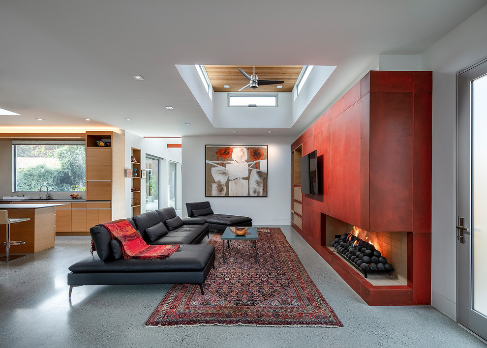 This is an example of a midcentury open concept family room in San Francisco with white walls, a ribbon fireplace, a wall-mounted tv, grey floor and recessed.