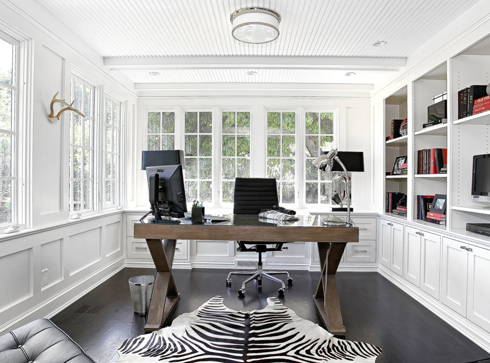 Large transitional freestanding desk dark wood floor study room photo in New York with white walls