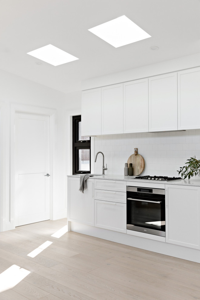 This is an example of a beach style kitchen in Sydney.