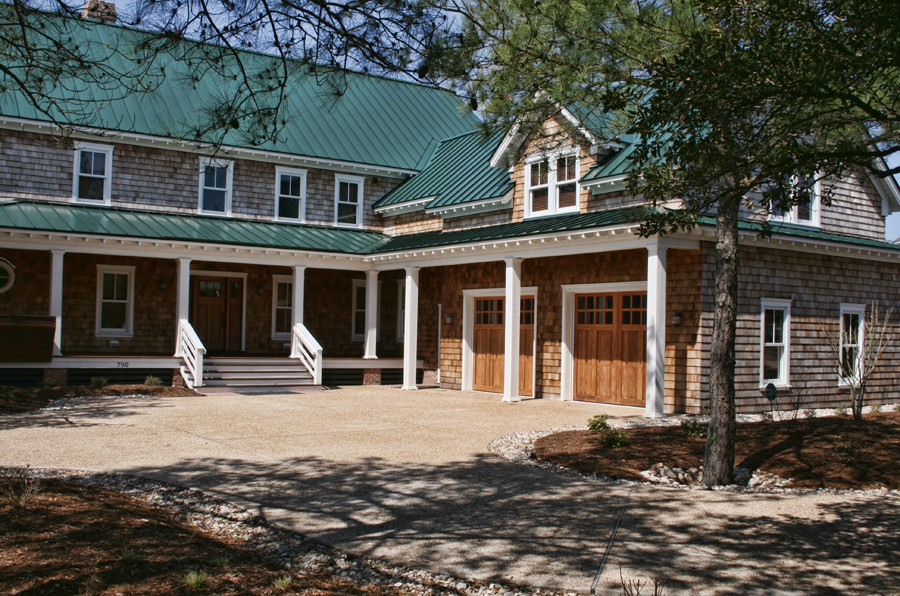 This is an example of a large beach style attached two-car garage in Atlanta.