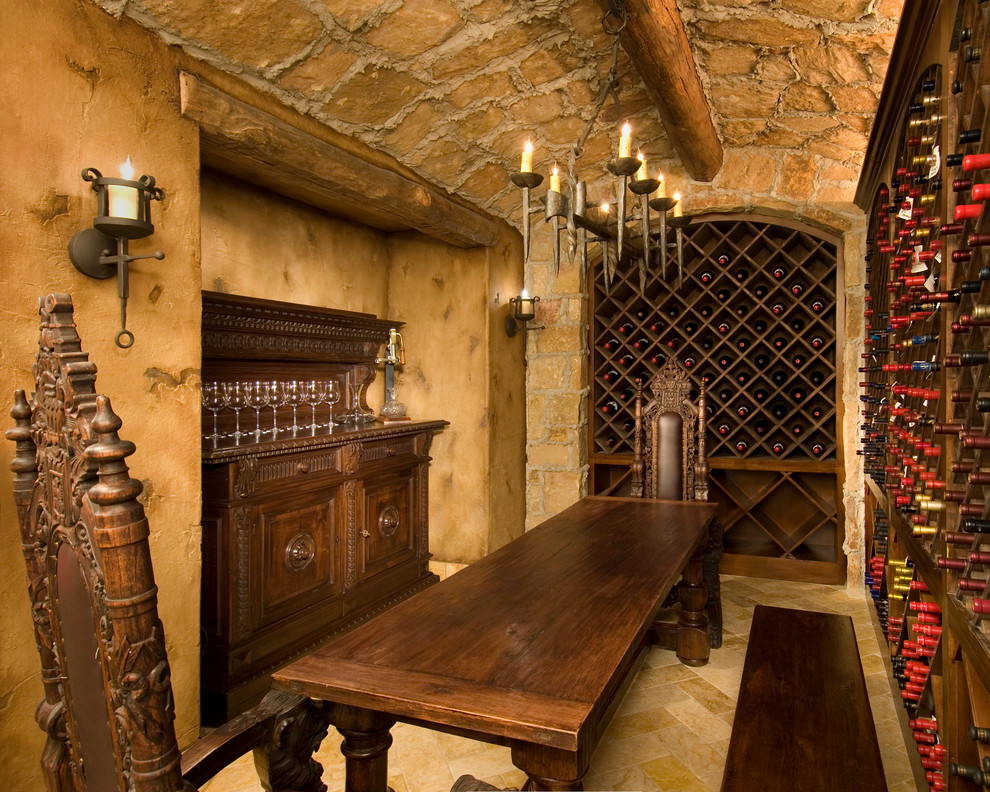 Design ideas for a mediterranean wine cellar in Dallas with diamond bins and beige floor.