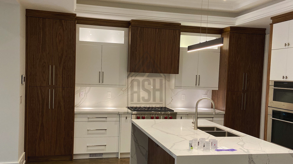 Photo of a medium sized modern l-shaped kitchen pantry in Toronto with a double-bowl sink, flat-panel cabinets, dark wood cabinets, quartz worktops, white splashback, stone slab splashback, stainless steel appliances, dark hardwood flooring, an island, brown floors, white worktops and a coffered ceiling.