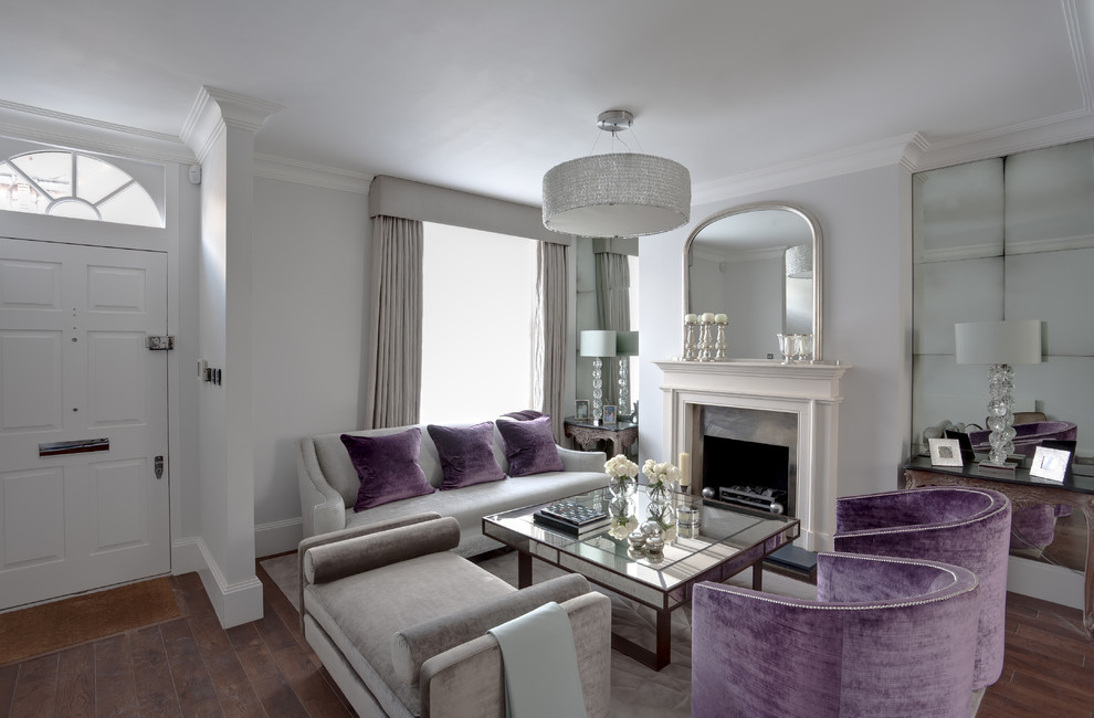 This is an example of a large traditional open concept living room in London with white walls, a standard fireplace and a metal fireplace surround.