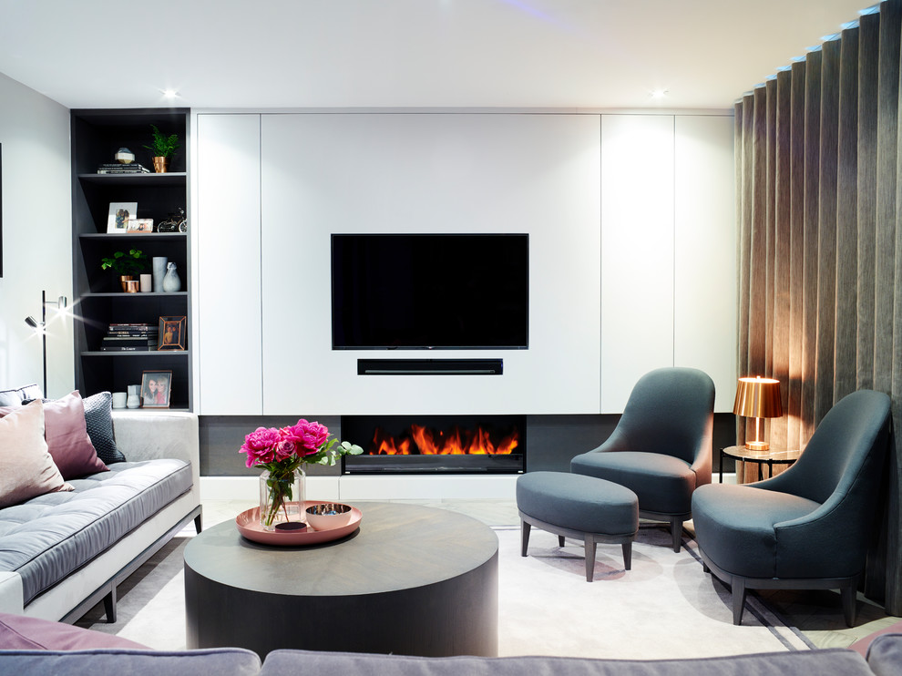 Photo of a mid-sized contemporary formal enclosed living room in Surrey with grey walls, medium hardwood floors, a ribbon fireplace, a wood fireplace surround and a built-in media wall.
