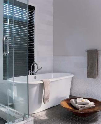 Inspiration for a mid-sized contemporary master wet room bathroom in Chicago with flat-panel cabinets, medium wood cabinets, a corner tub, multi-coloured walls, granite benchtops and a hinged shower door.