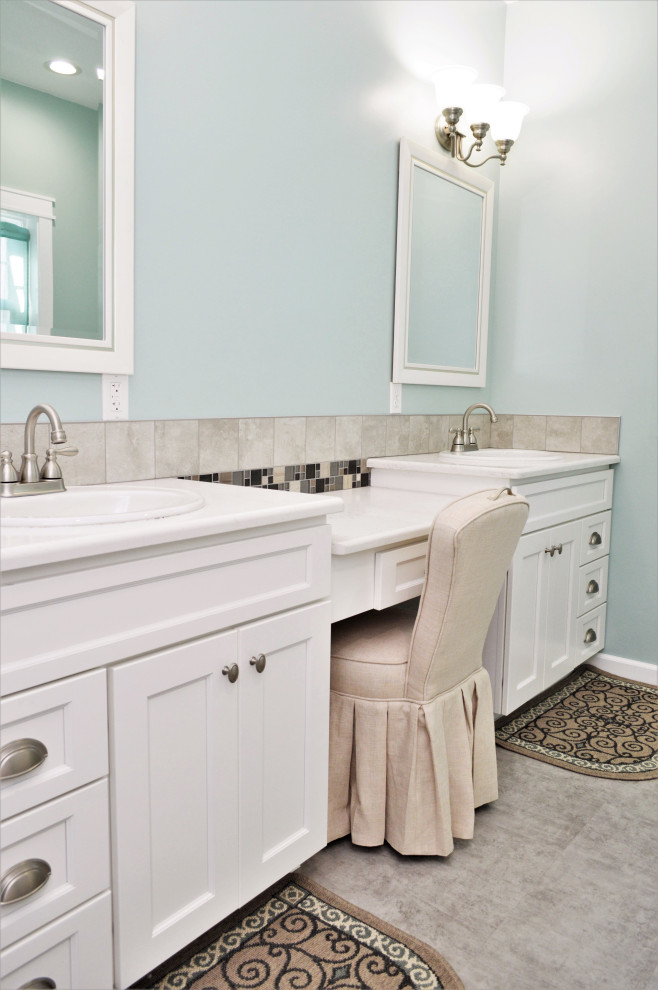 Large transitional master single-sink bathroom photo with shaker cabinets, white cabinets, blue walls, a drop-in sink, quartzite countertops, white countertops and a built-in vanity