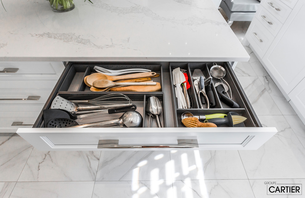 Huge transitional l-shaped marble floor eat-in kitchen photo in Montreal with an undermount sink, shaker cabinets, white cabinets, quartzite countertops, gray backsplash, glass tile backsplash, paneled appliances and an island
