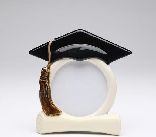 Black Graduation Hat with Hanging Gold Tassel on White Picture Frame