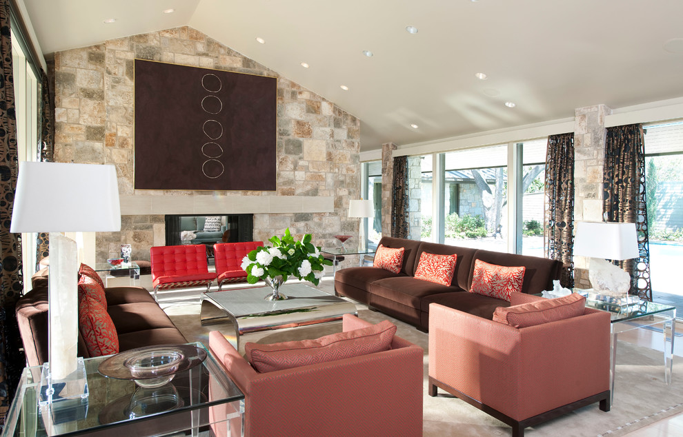 This is an example of a mid-sized contemporary open concept living room in Dallas with a two-sided fireplace, beige walls, light hardwood floors, a stone fireplace surround, no tv and beige floor.