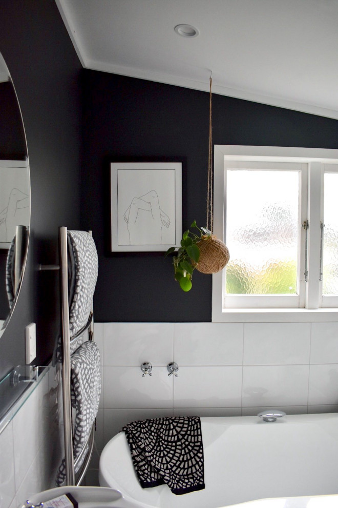 Inspiration for a mid-sized modern master white tile and ceramic tile ceramic tile, black floor, single-sink and tray ceiling freestanding bathtub remodel in Auckland with white cabinets, black walls, a pedestal sink and a freestanding vanity