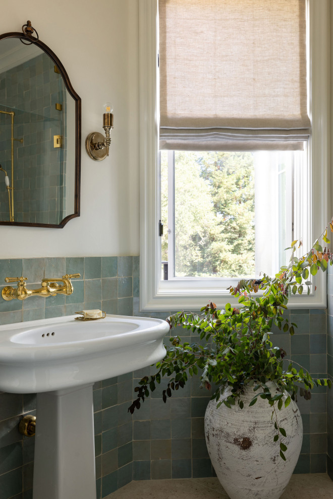 Design ideas for a classic bathroom in Sacramento with blue tiles, a pedestal sink, beige floors and a single sink.