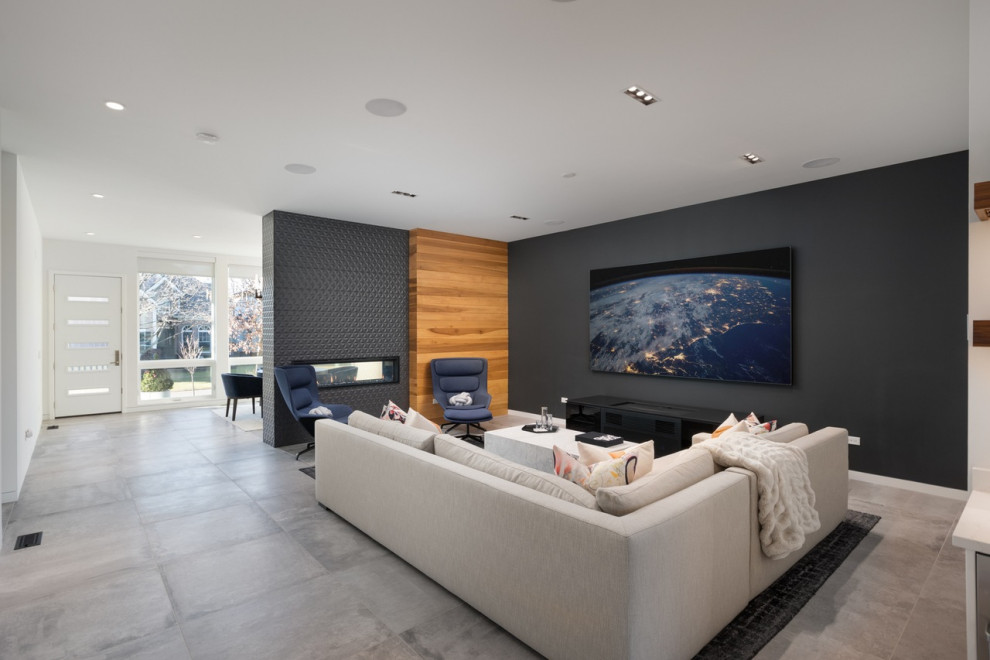 Large modern formal open concept living room in Chicago with white walls, a two-sided fireplace, a wall-mounted tv, a tile fireplace surround, grey floor, porcelain floors and panelled walls.
