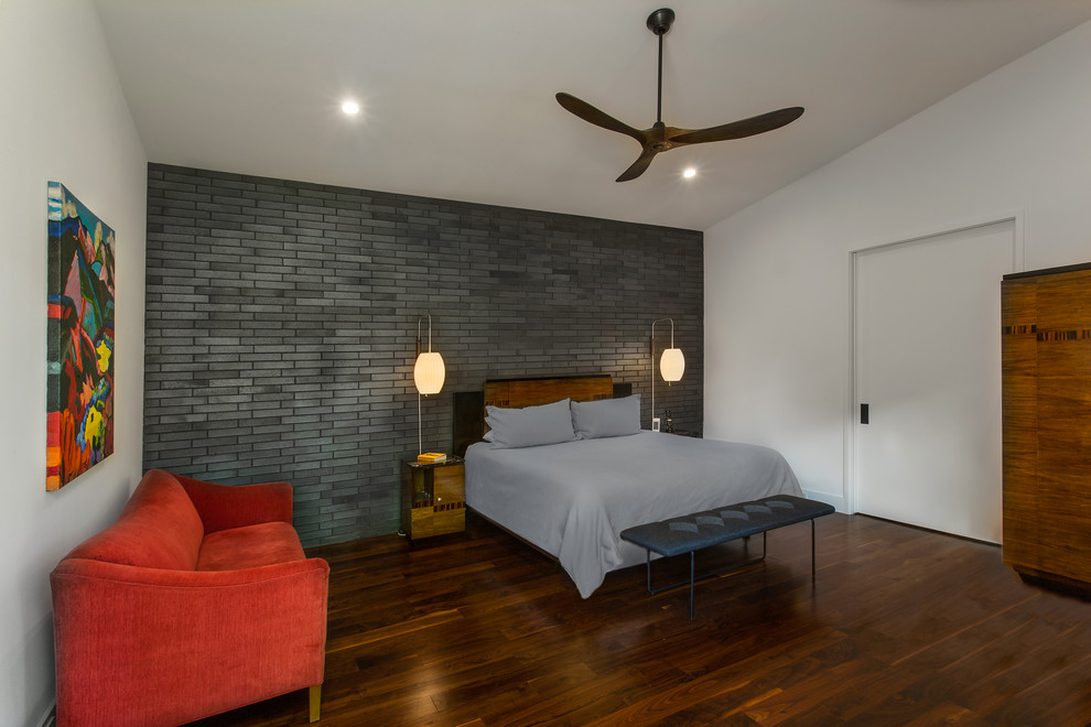 Mid-sized midcentury master bedroom in Dallas with white walls, brown floor, no fireplace and medium hardwood floors.
