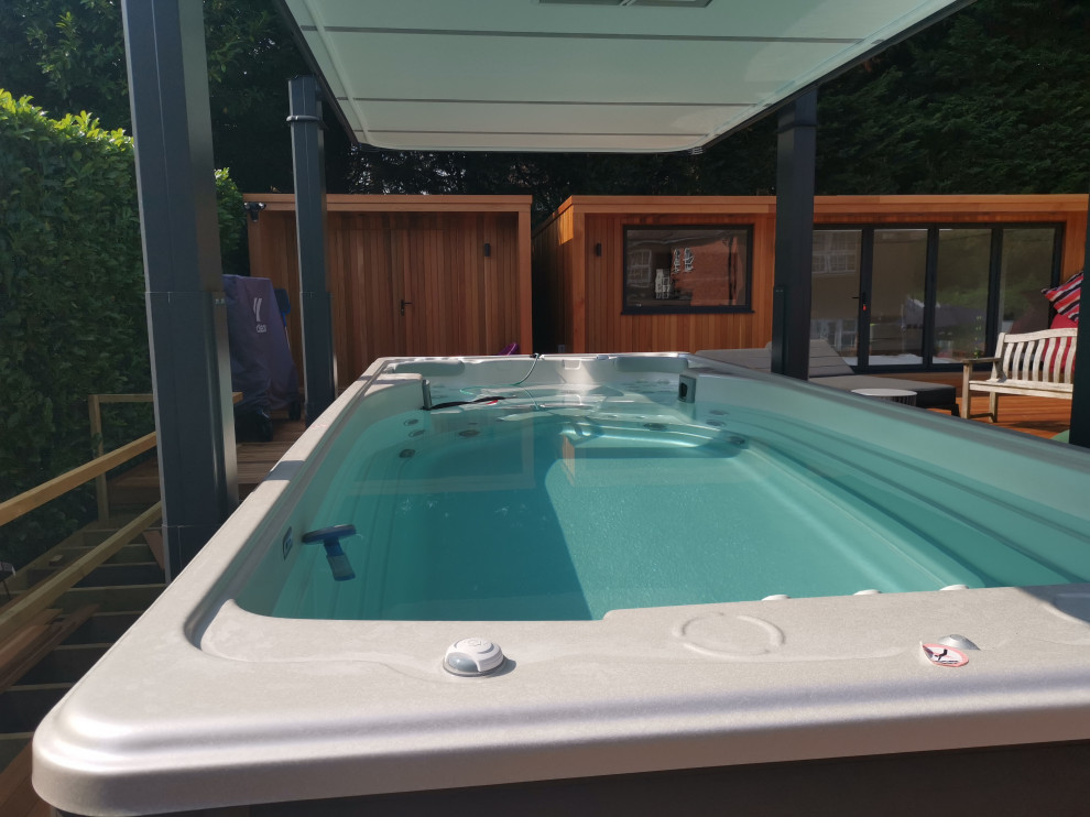 Photo of a scandinavian pool in Hertfordshire with a hot tub.